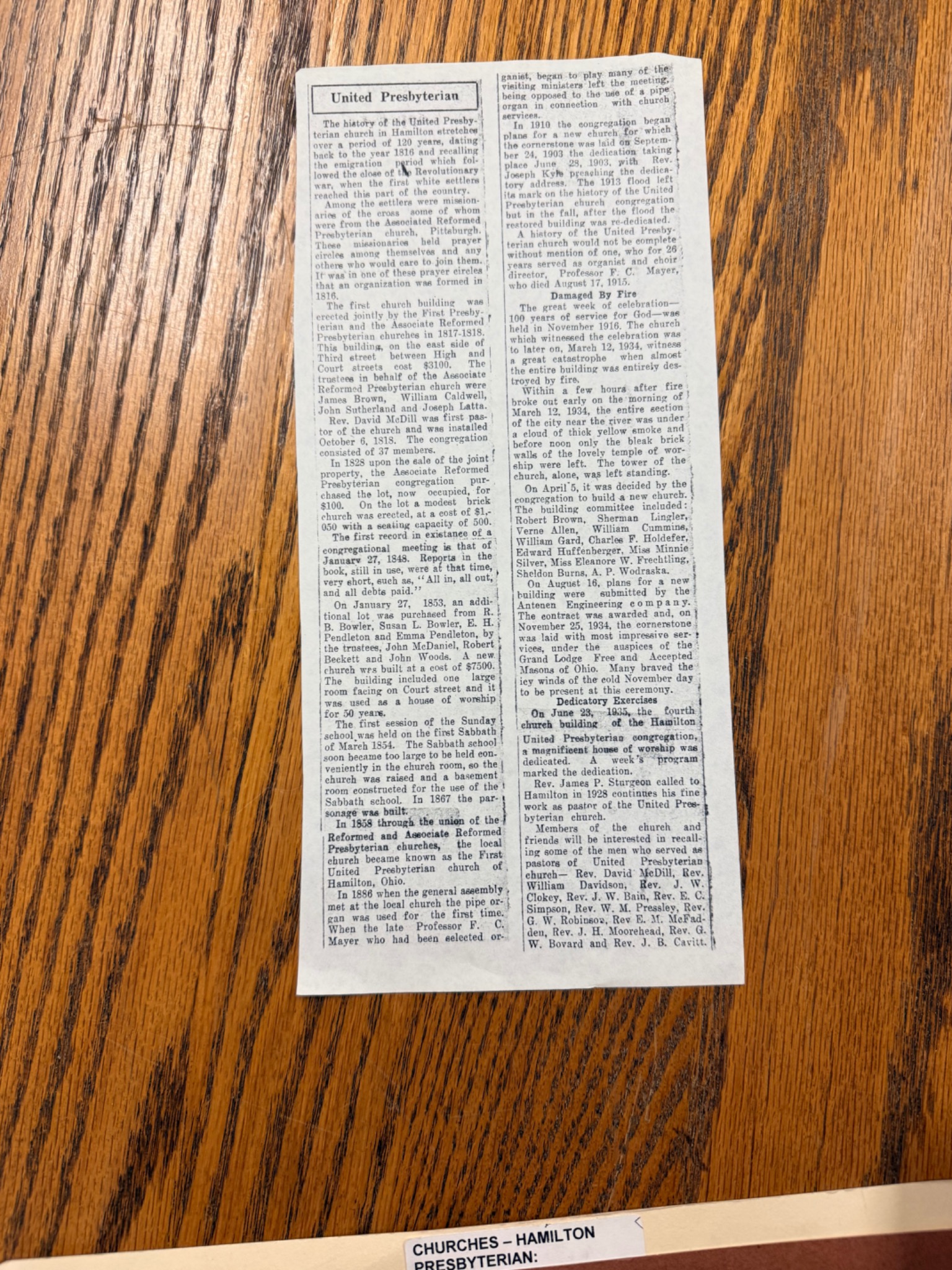 United Presbyterian historical newspaper clipping describing the 1934 fire and John Woods trustee role